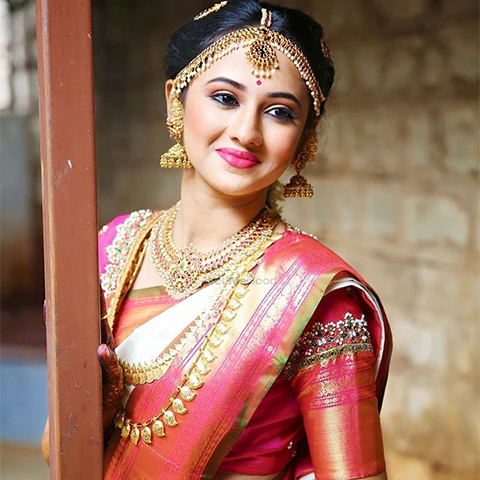 South Indian bridal makeup with red silk saree and gold jewellery — Shubhangi Makeup Studio Nanded